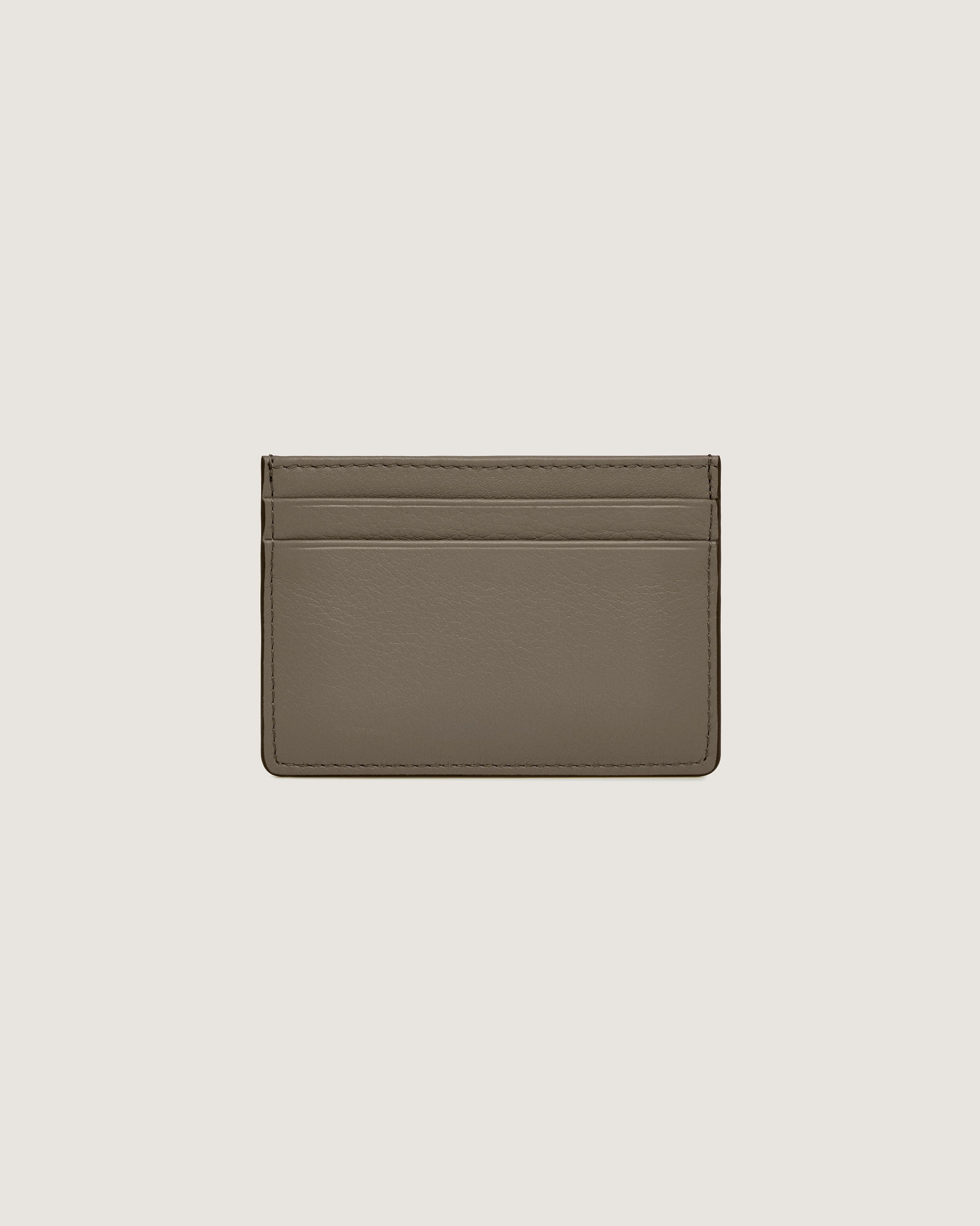 A brown card case on a white background