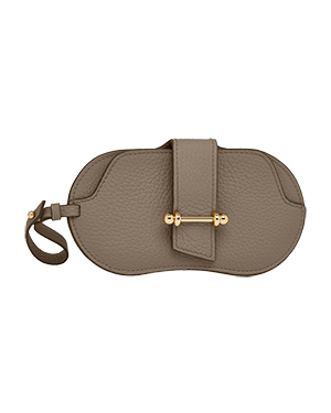 A small grey purse with a gold handle