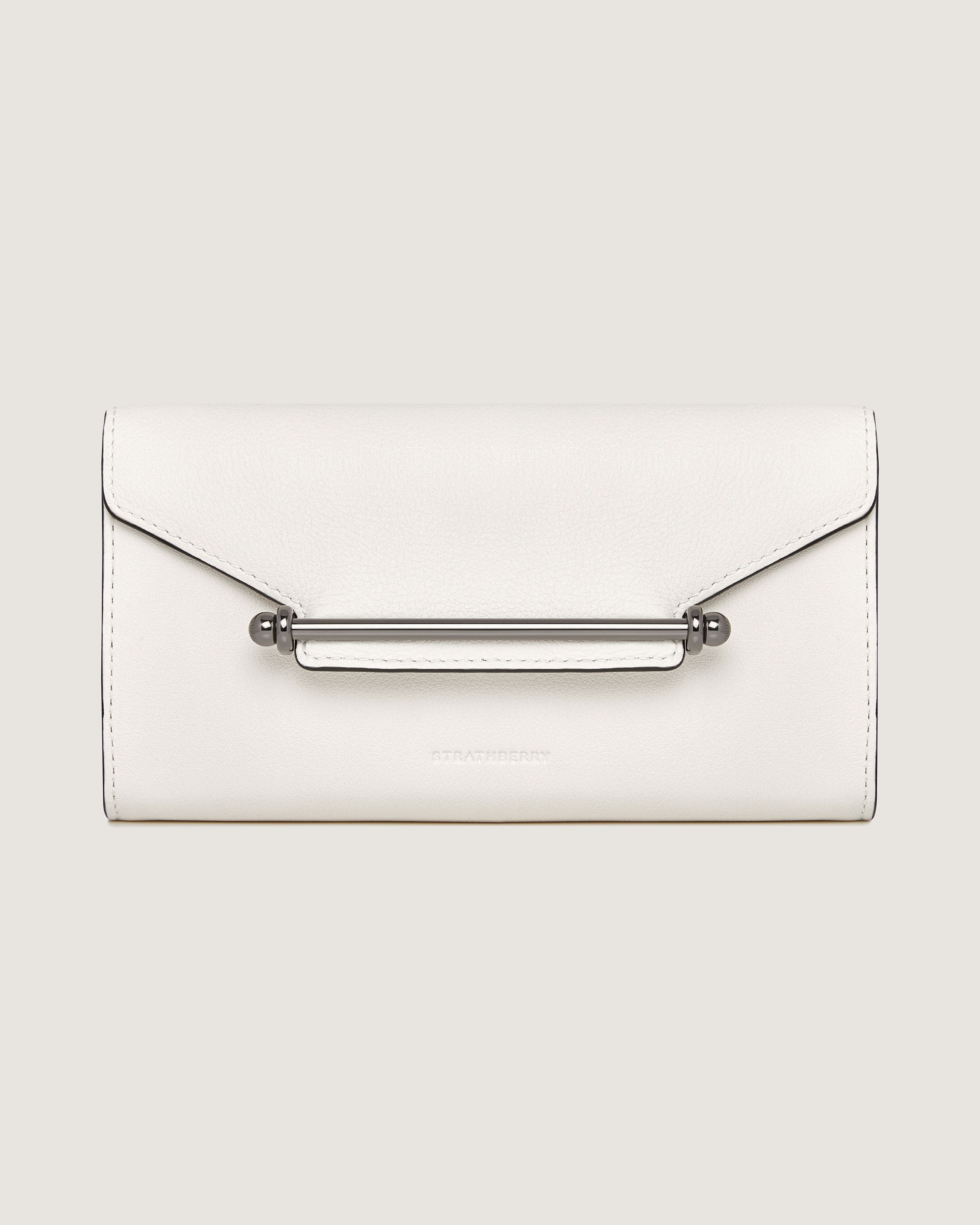 A white clutch bag with a metal handle