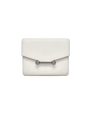 A white purse with a metal handle