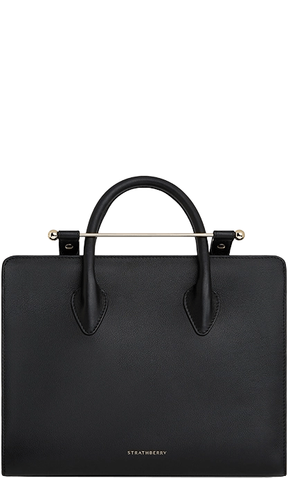 A black leather handbag with a metal handle