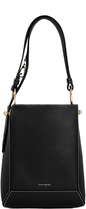 A black handbag with a tasselled handle