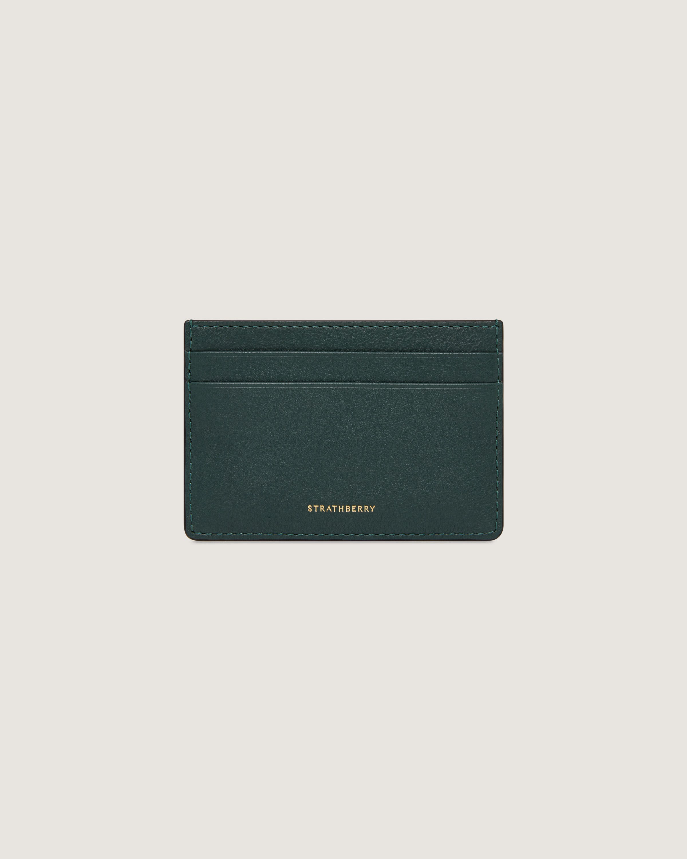 A green card case with a gold logo on the front