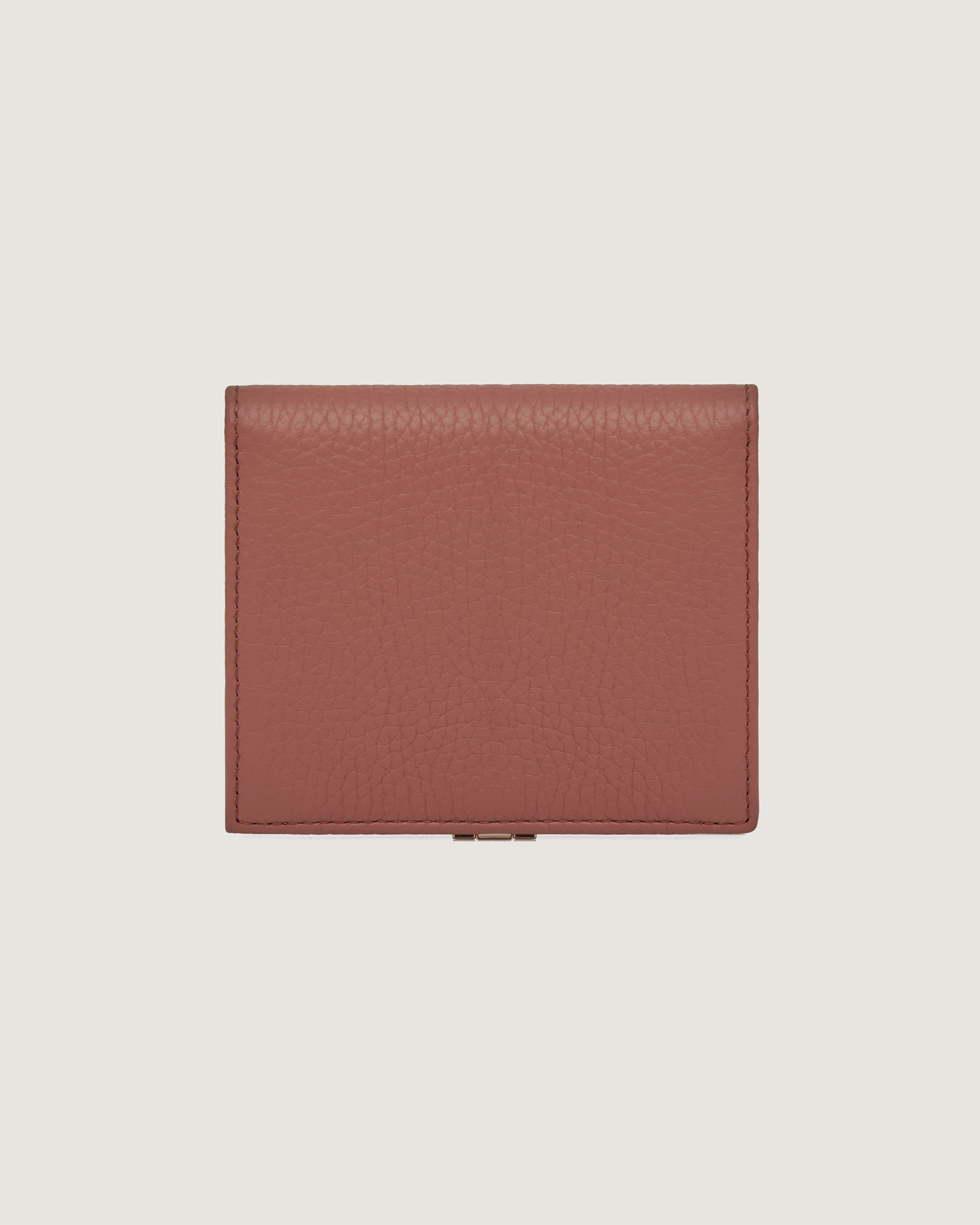 A brown leather wallet on a white background