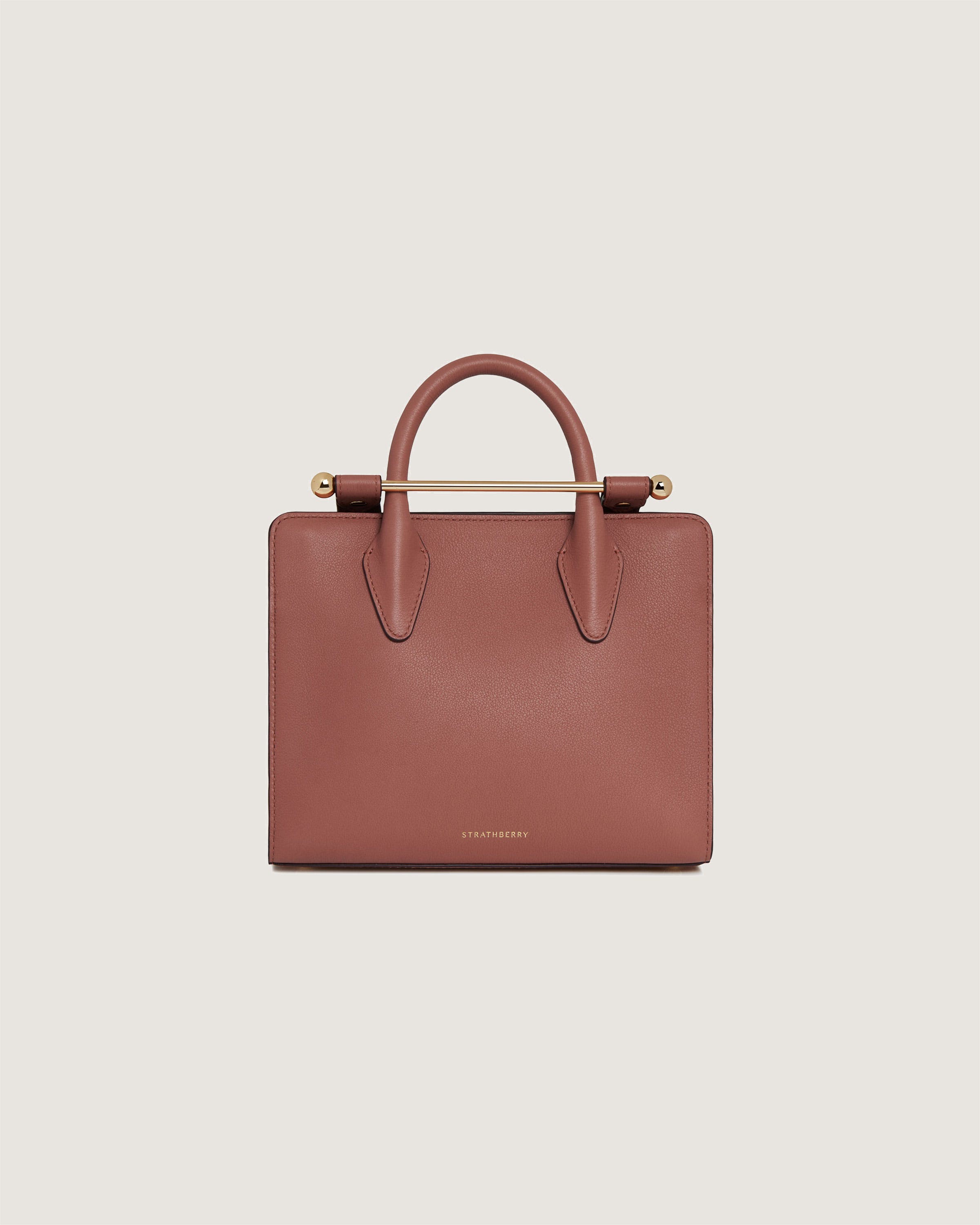 A brown handbag on a white background