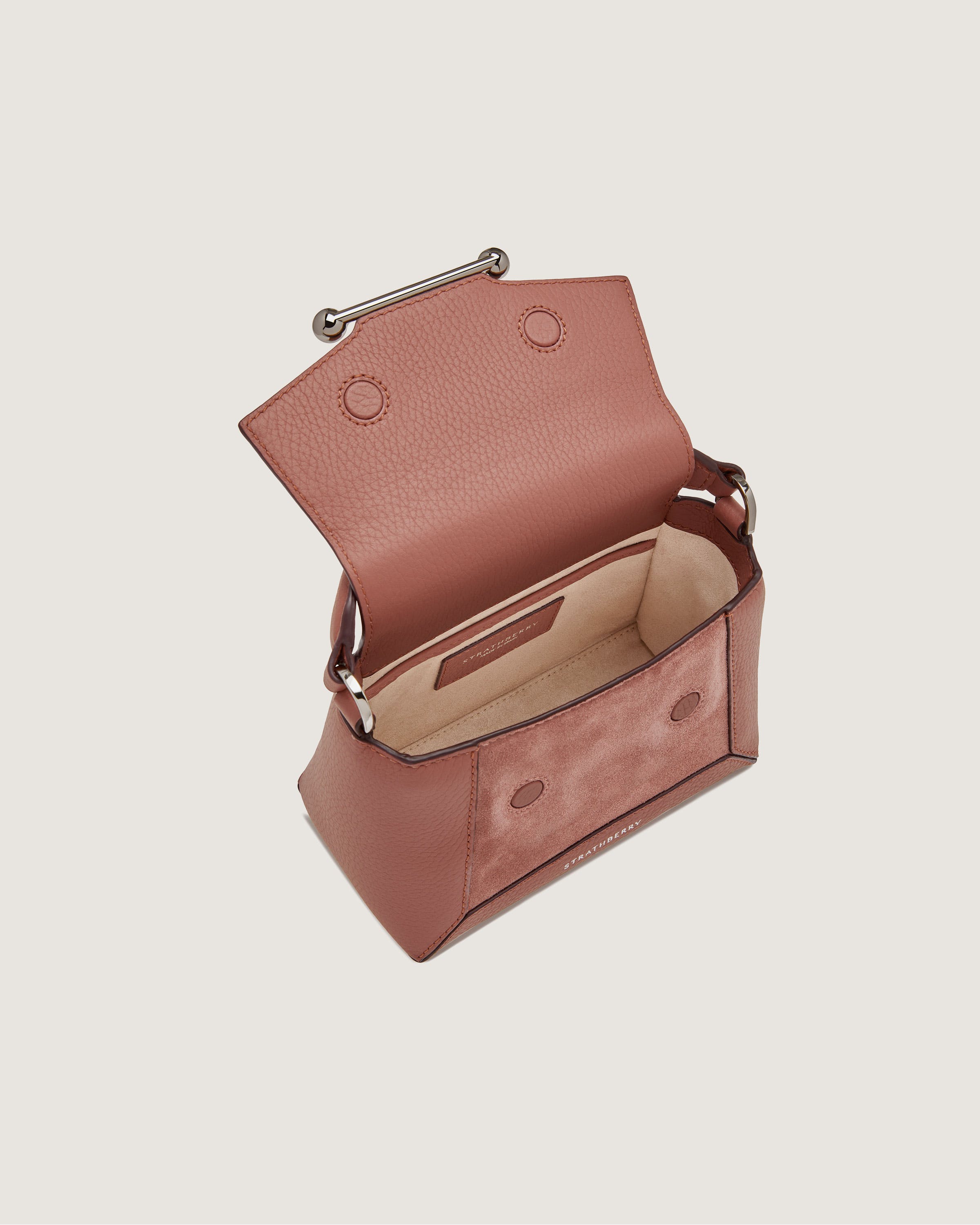 A small pink purse with a handle