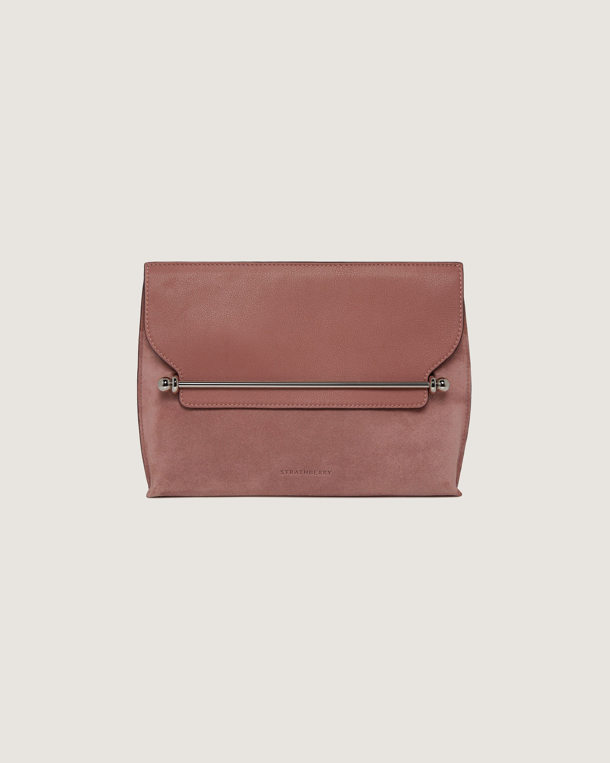 A pink leather clutch bag with a zipper