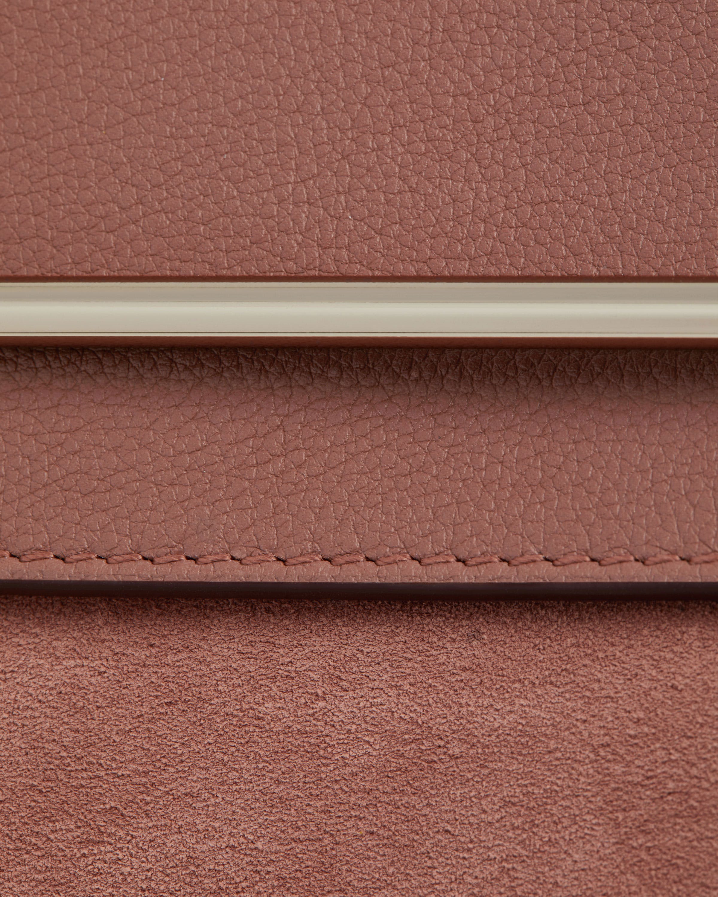 A close up of a brown leather purse