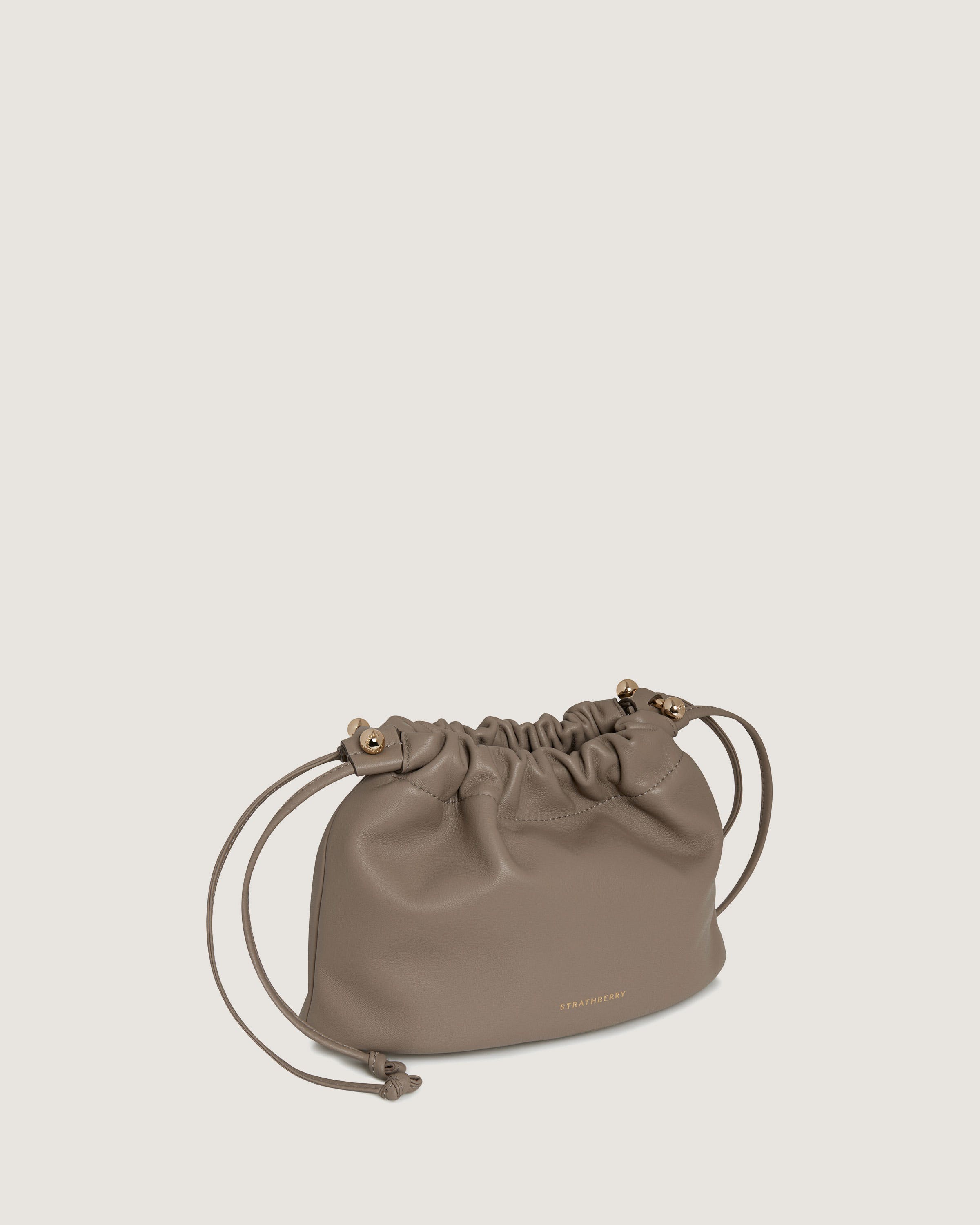 A small grey bag with a drawstring strap