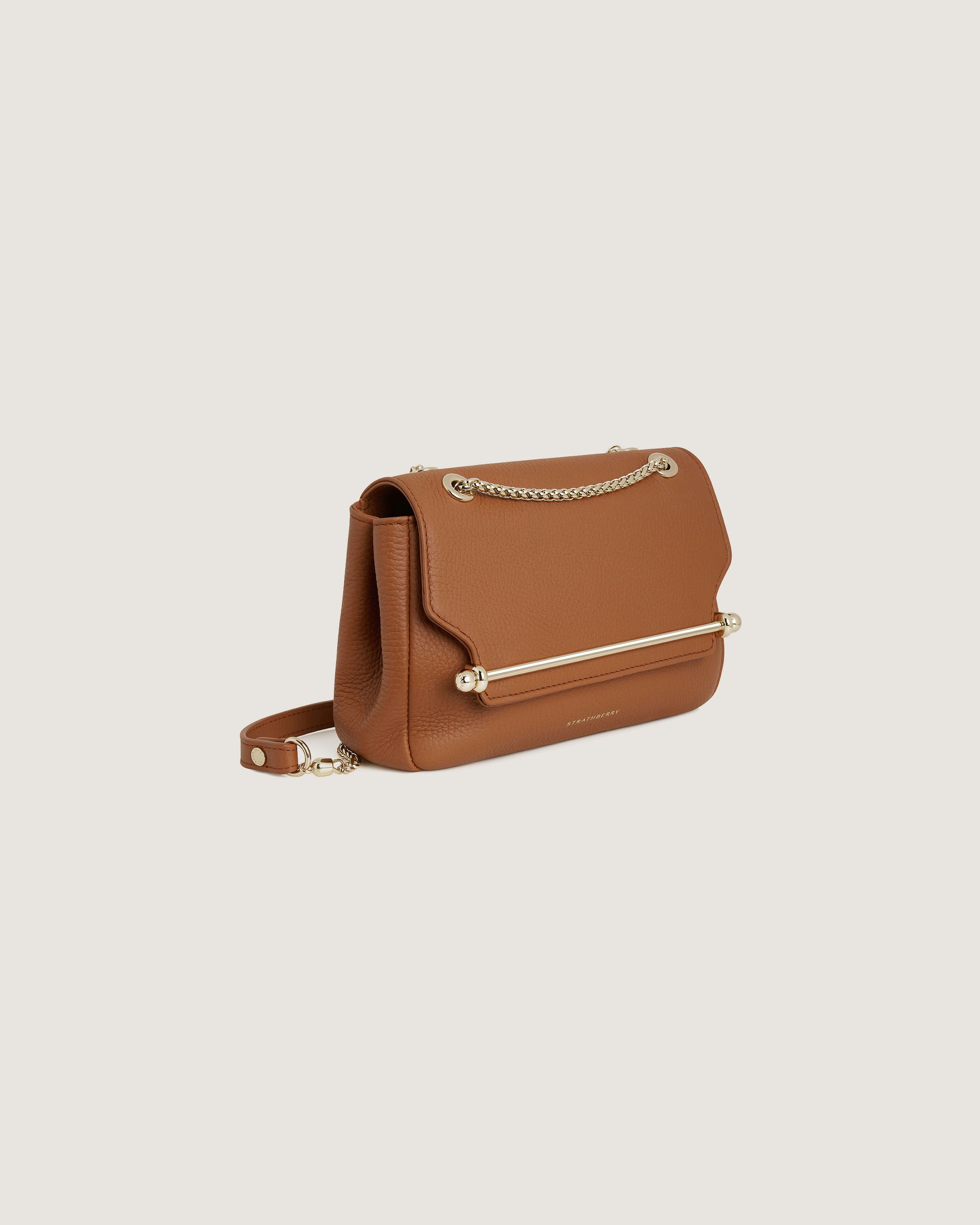 A brown handbag on a white background