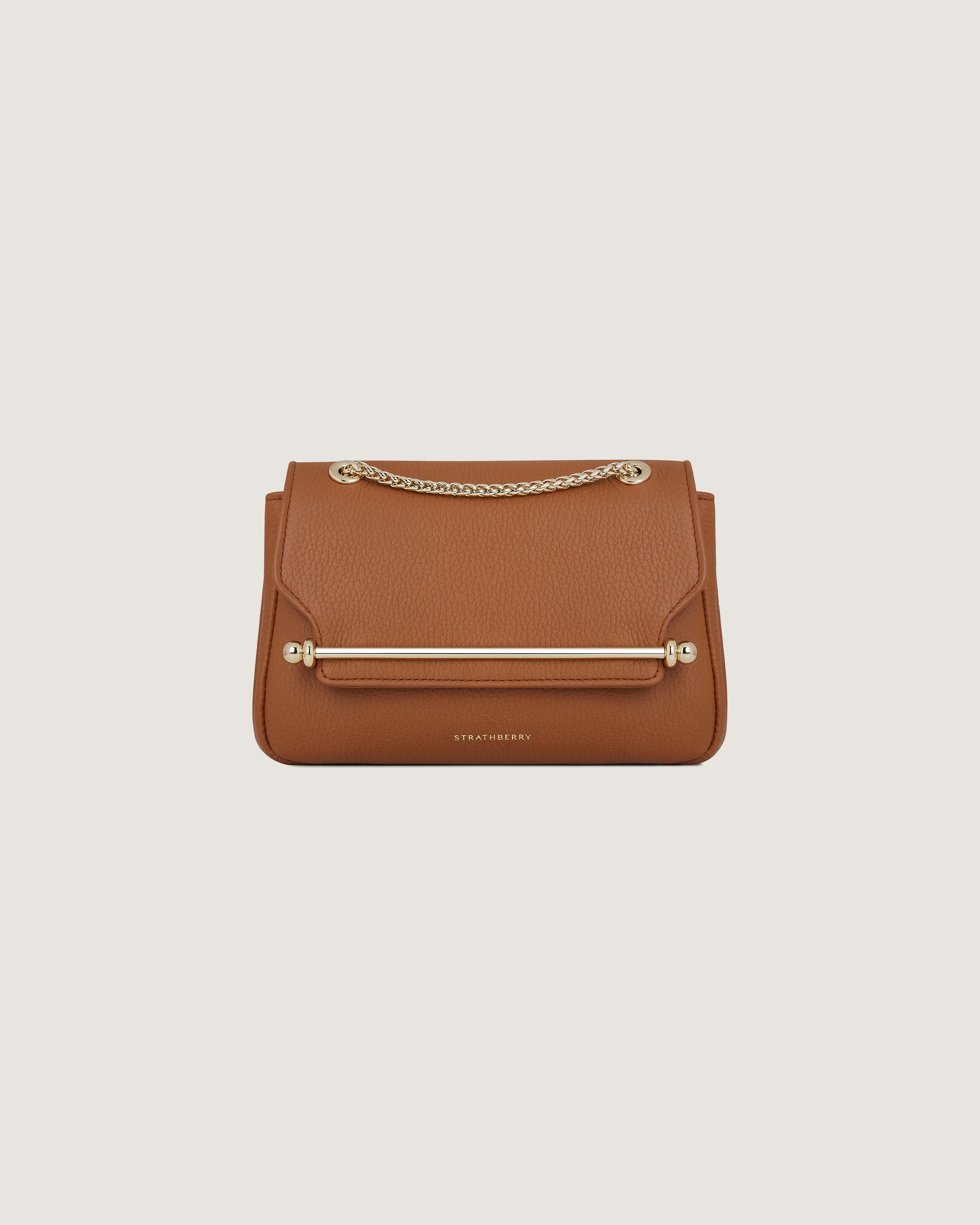 A brown handbag on a white background