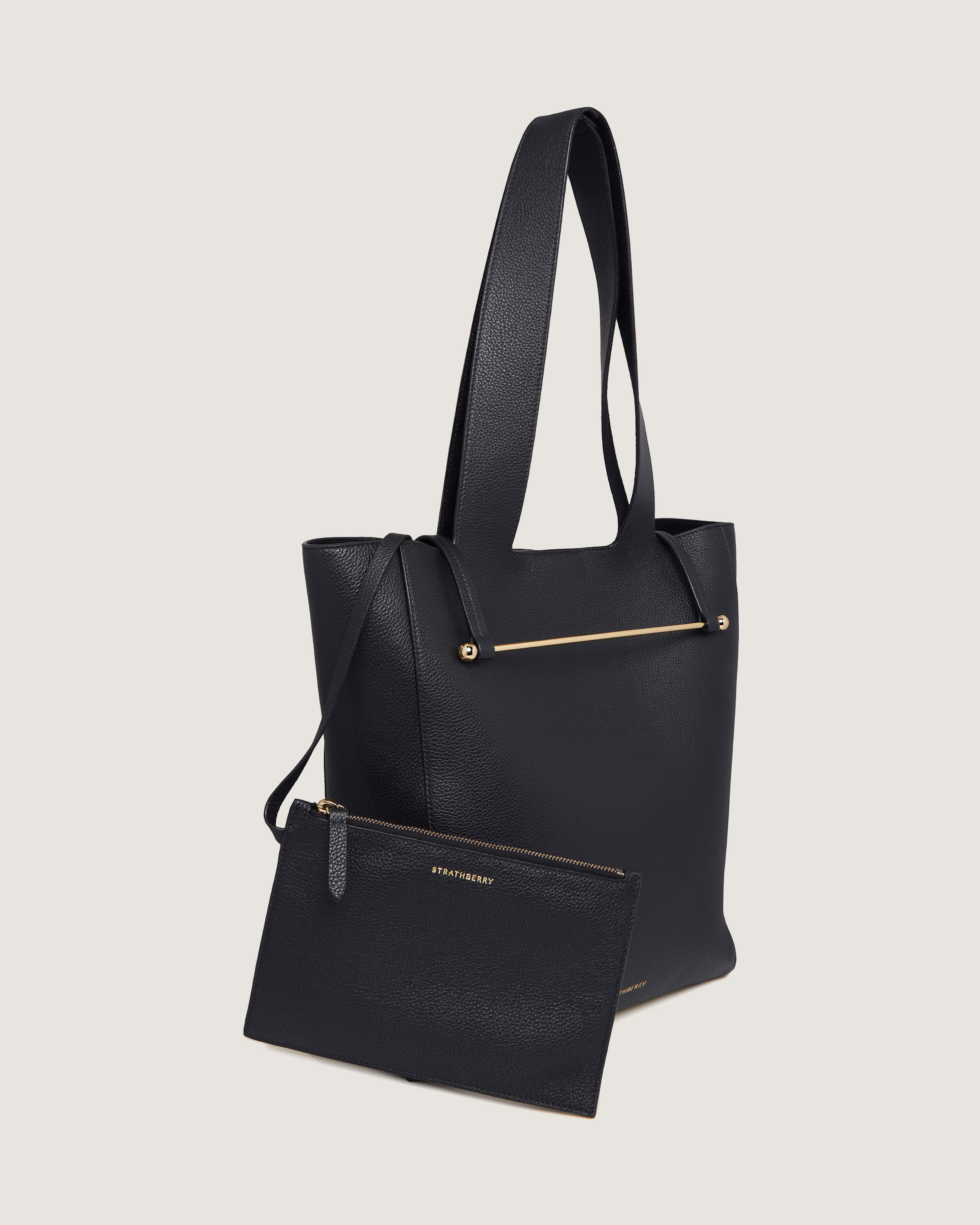 A black tote bag with a matching pouch