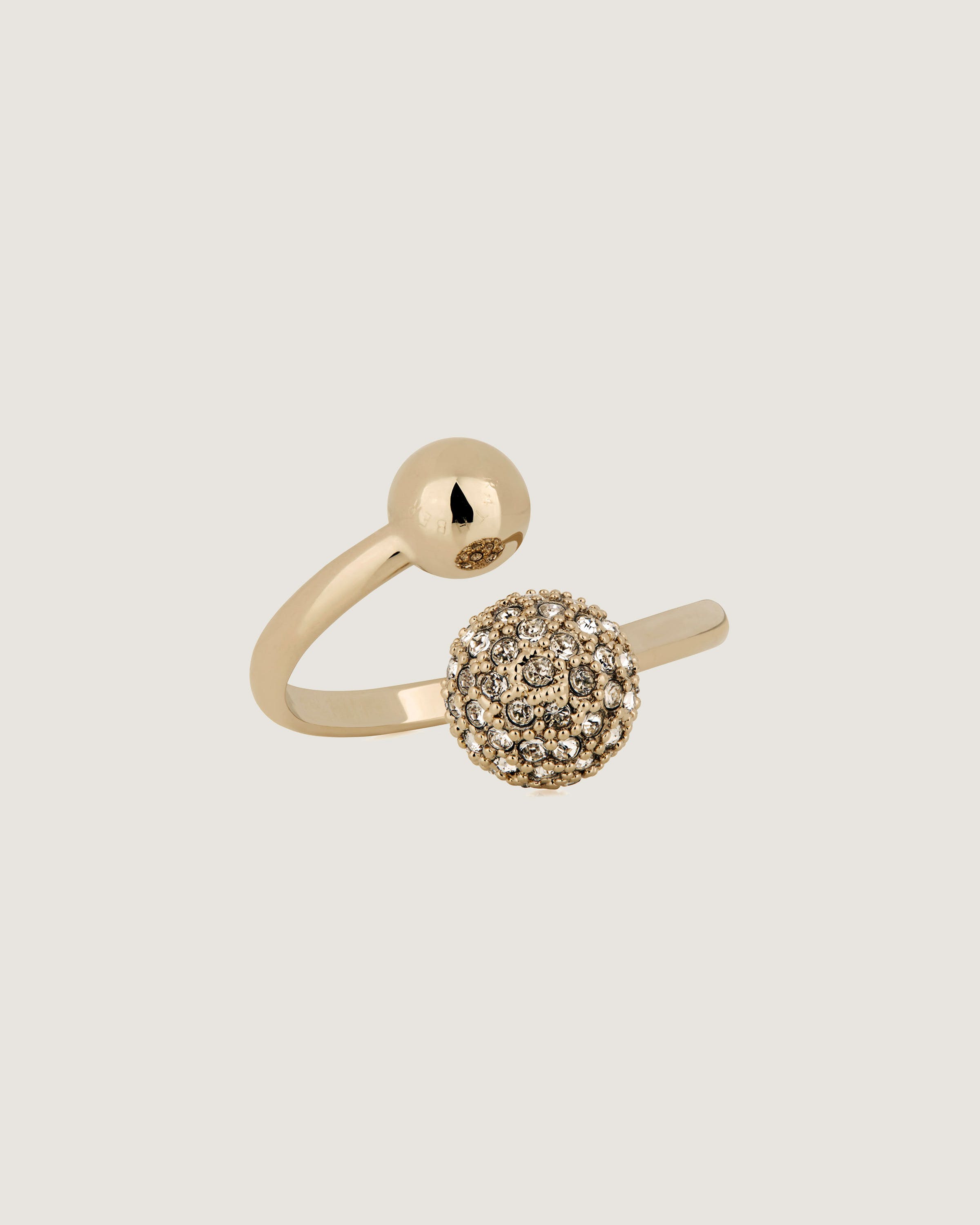 A gold ring with a ball on top of it