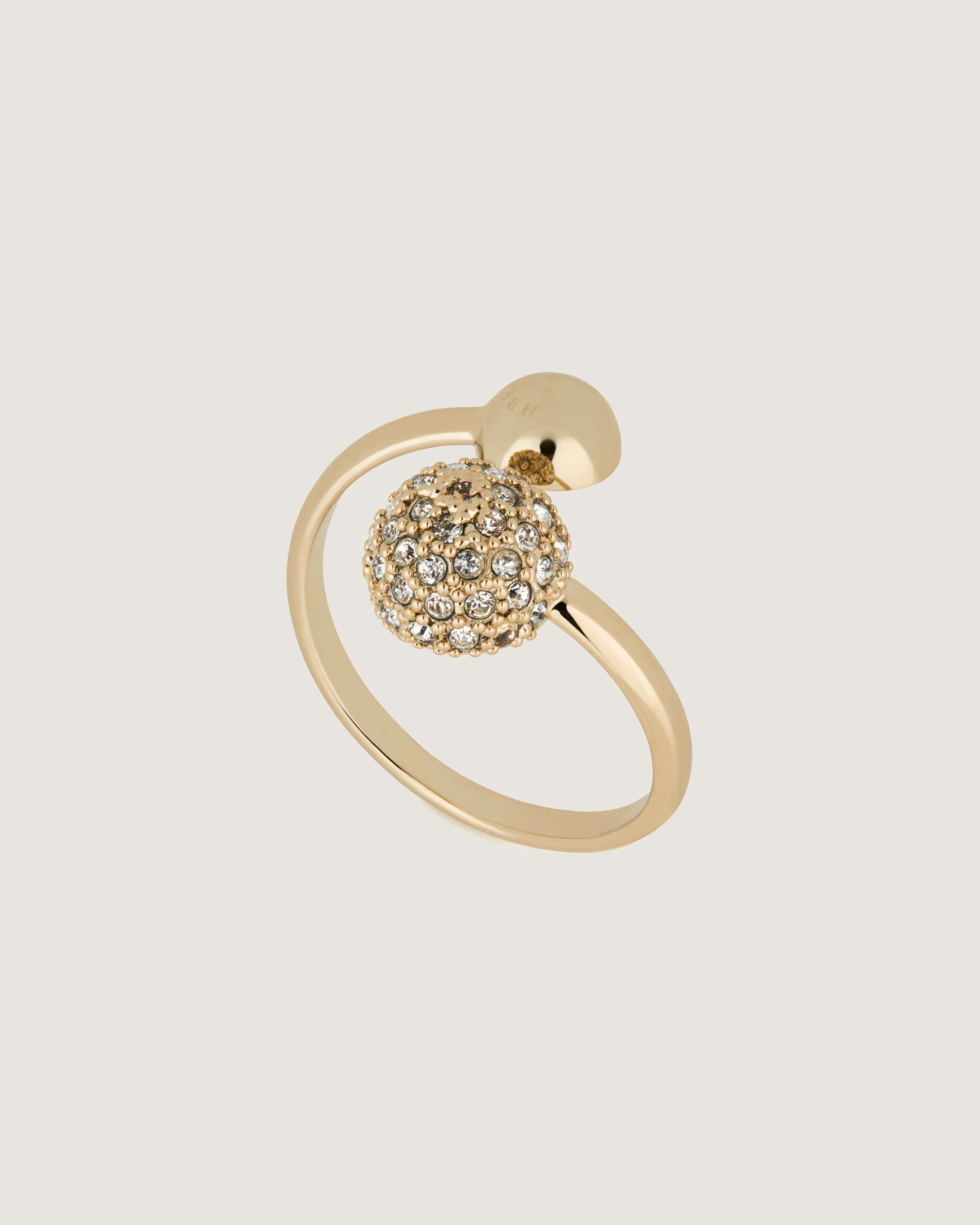 A gold ring with a ball on top of it