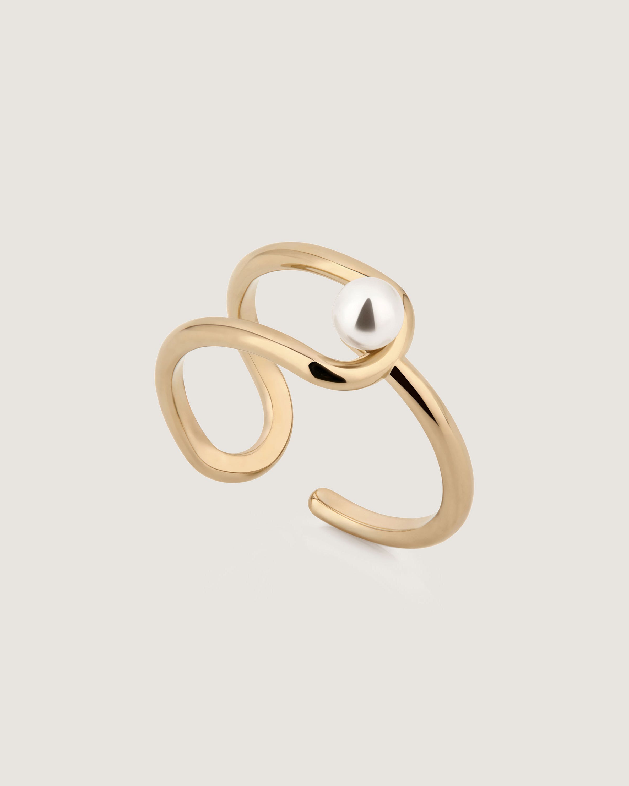 A gold ring with a pearl in the middle