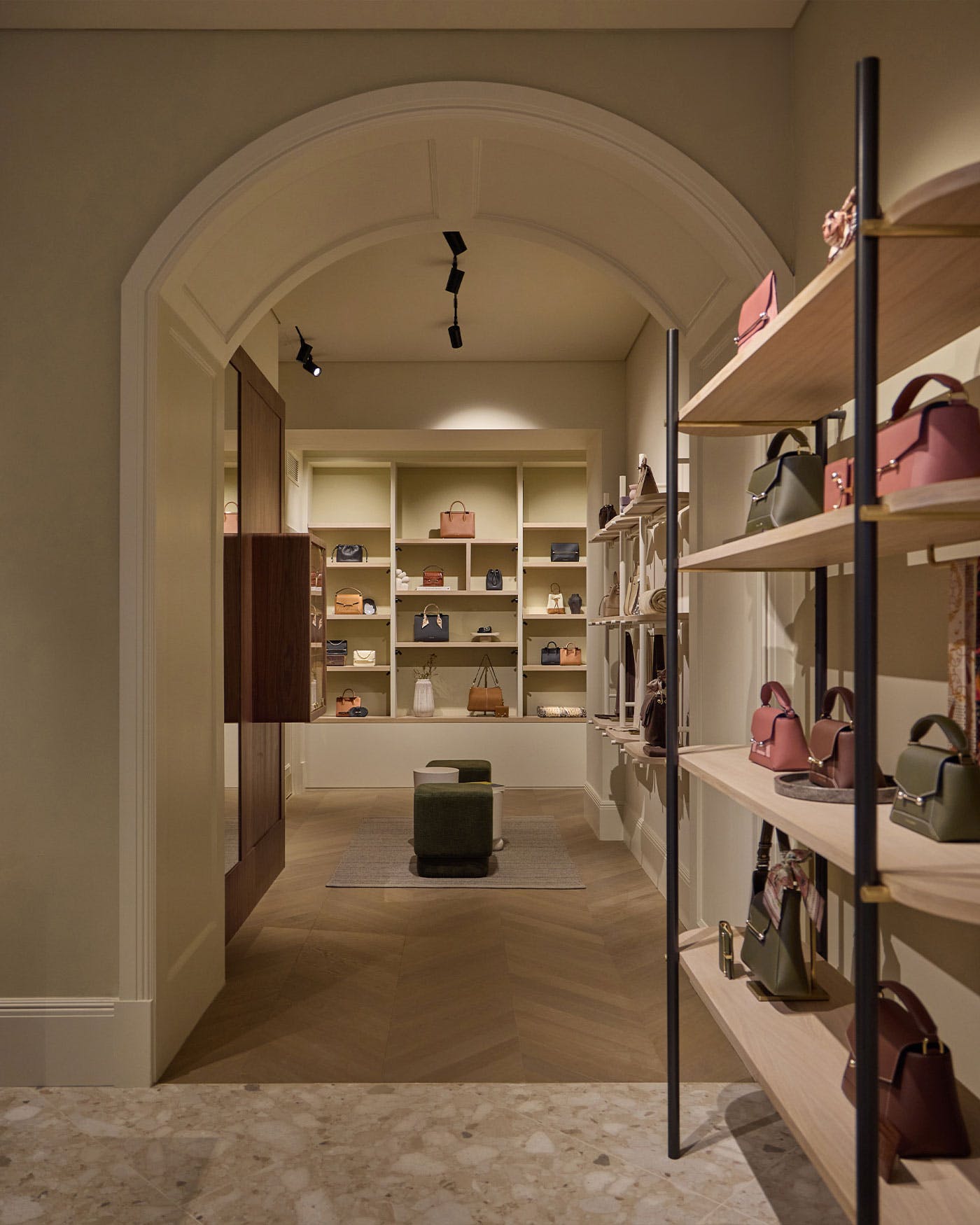 A room filled with lots of shelves filled with purses