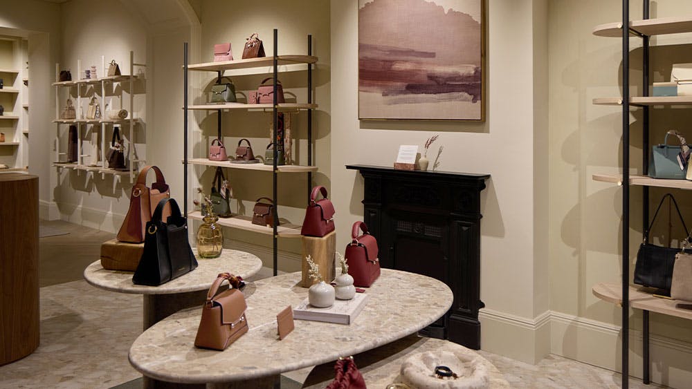 A display of handbags and purses in a store