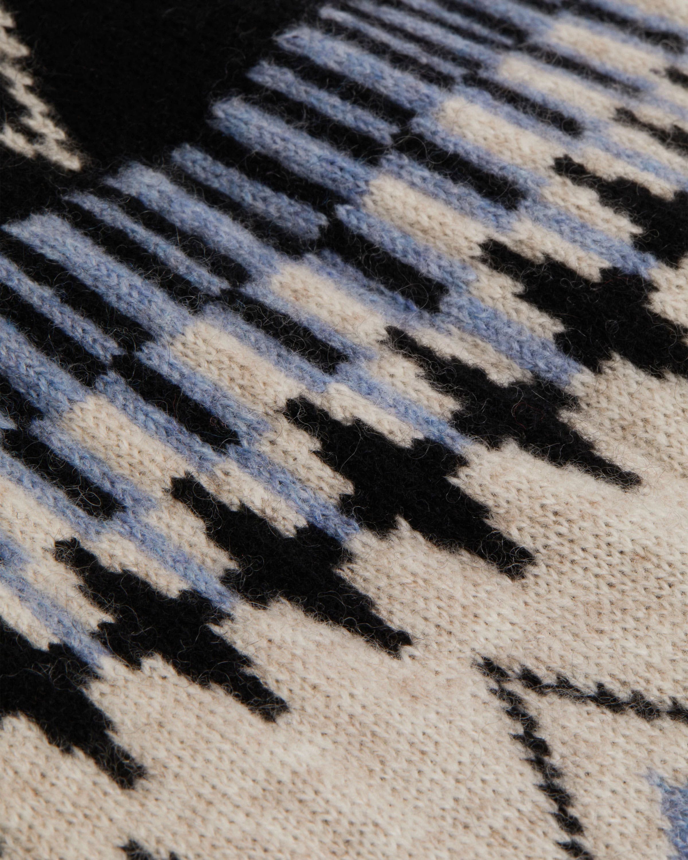 A close up of a black and white rug