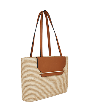 A straw bag with a tan leather handle