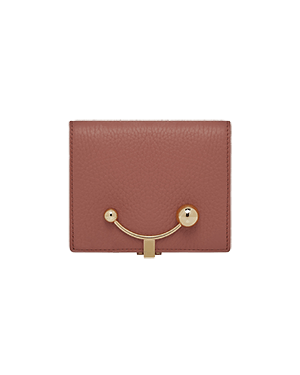 A pink wallet with a gold handle