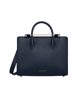 Strathberry midi tote in marine blue with top handles and gold bar