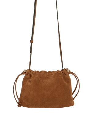Tan suede drawstring bag with long shoulder strap and gathered top.