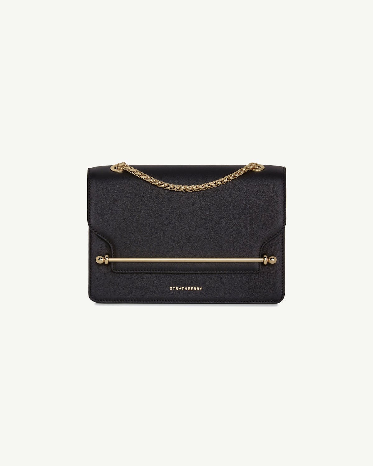 Strathberry black East/West bag with gold bar and chain handle.