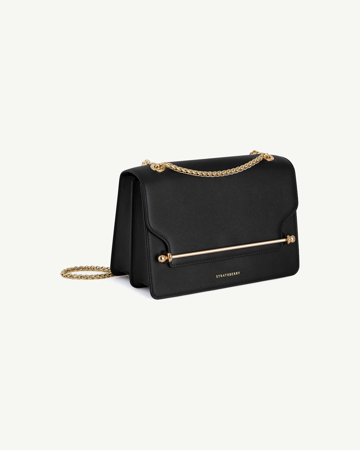 Strathberry black East/West bag with gold chain and bar detail