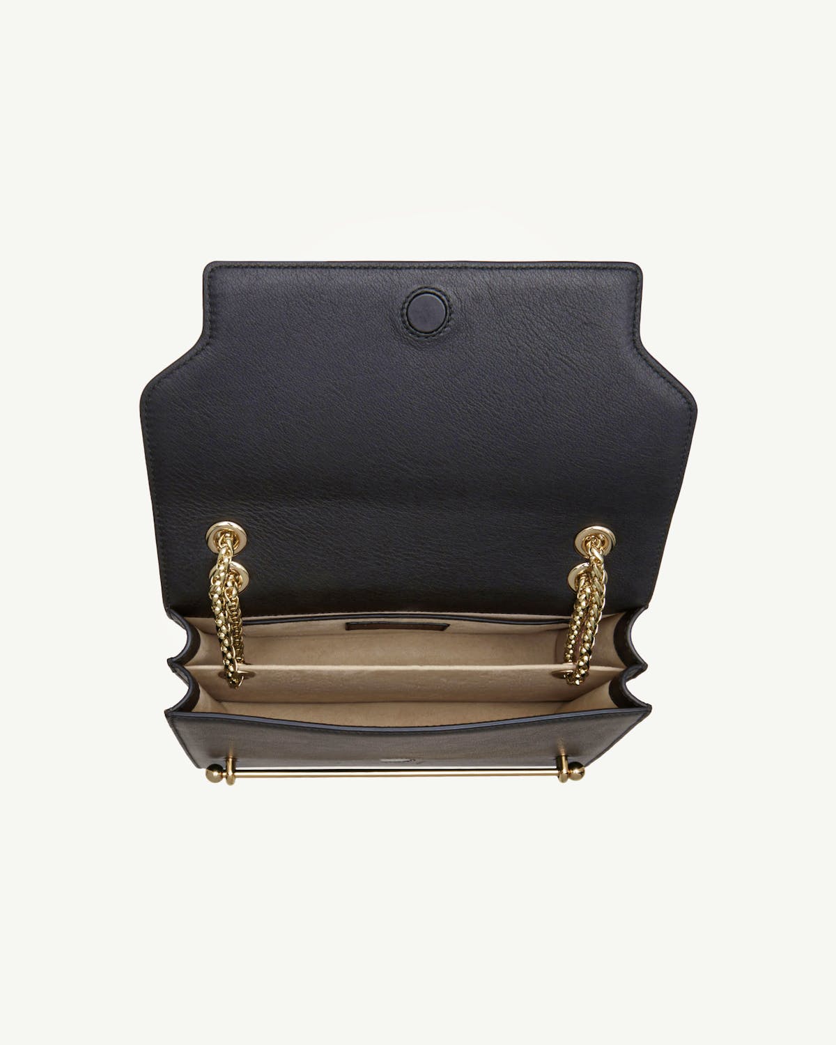 Black east/west bag with open flap showing beige interior and gold chain