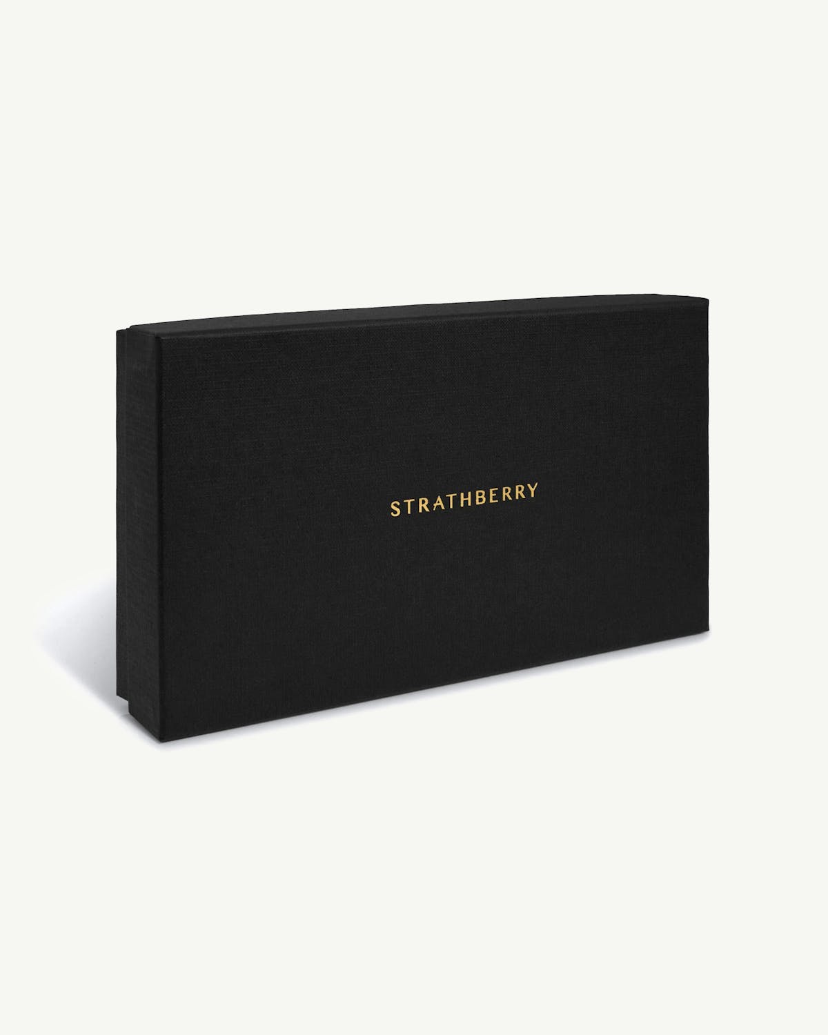 Black textured gift box with gold Strathberry logo on white background.