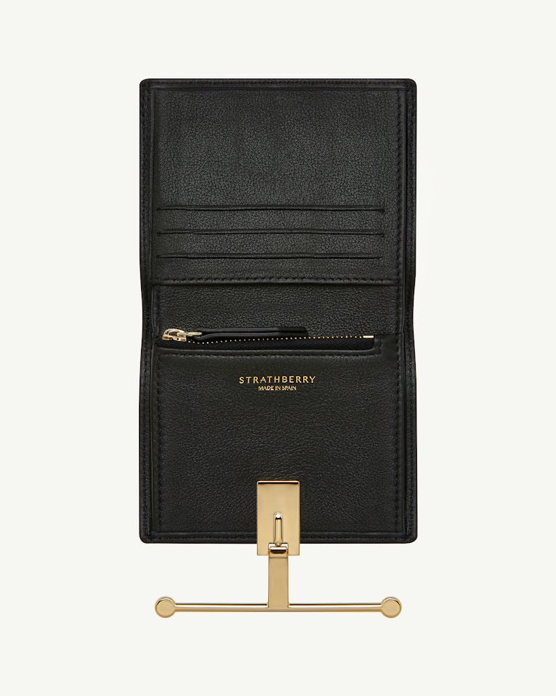 Strathberry Melville Street Wallet open in black leather with gold bar closure