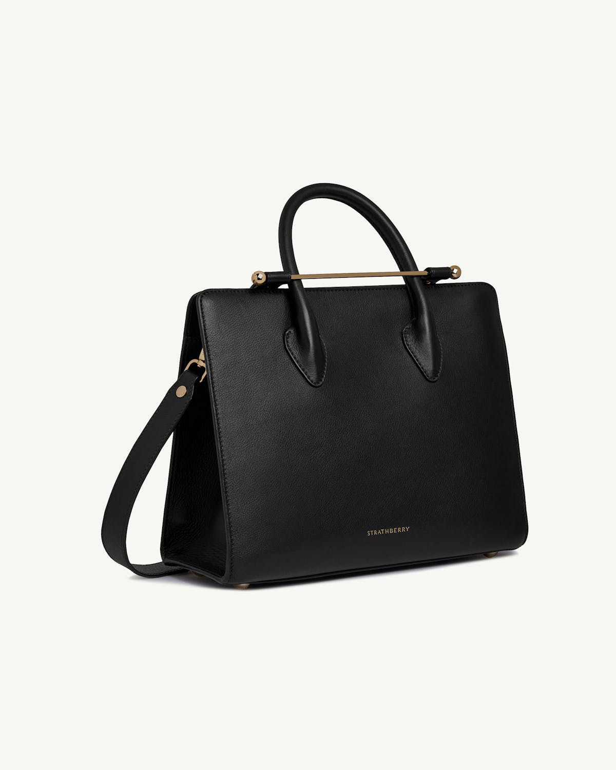Strathberry black midi tote with top handles, shoulder strap and gold bar