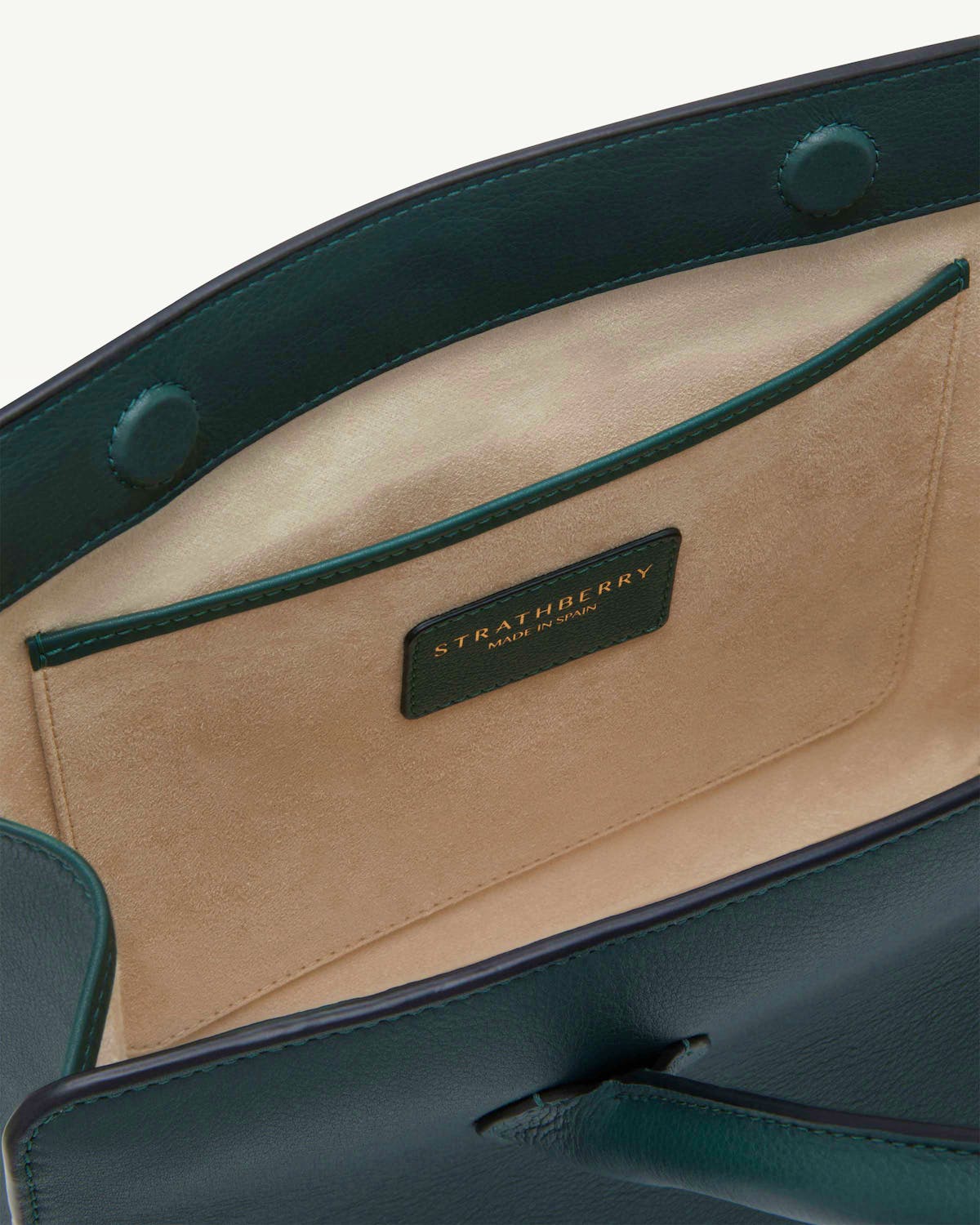 Strathberry bottle green midi tote interior with suede pocket and logo label