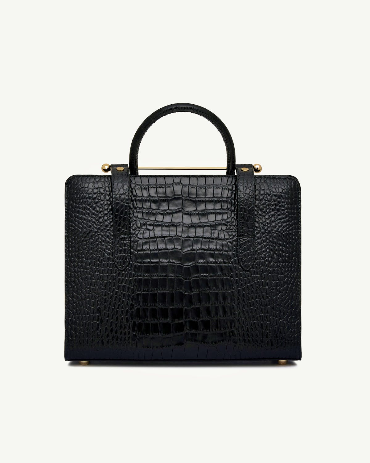Black croc-texture midi tote with top handle and gold bar detail, front view