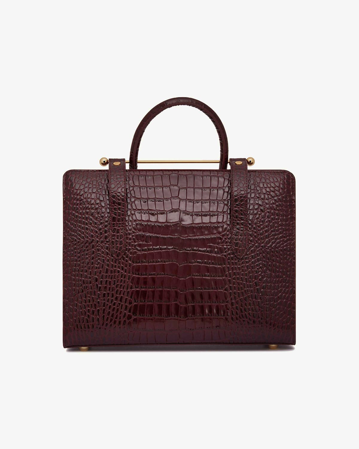 Burgundy croc-embossed midi tote with top handle and gold bar detail.