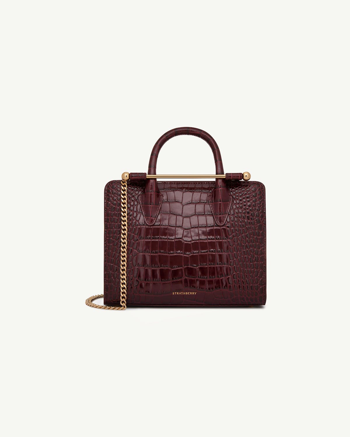 Burgundy croc mini tote with top handles, gold bar and chain strap, Strathberry