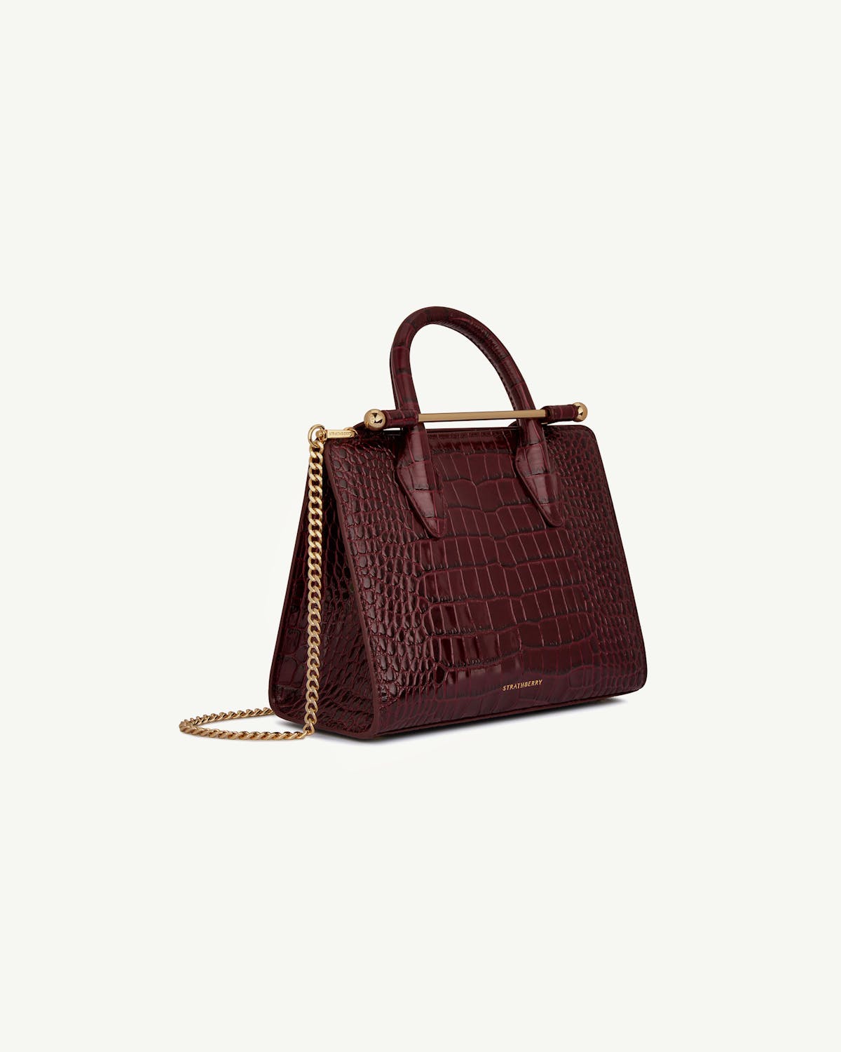 Strathberry croc mini tote with top handle and gold chain, burgundy