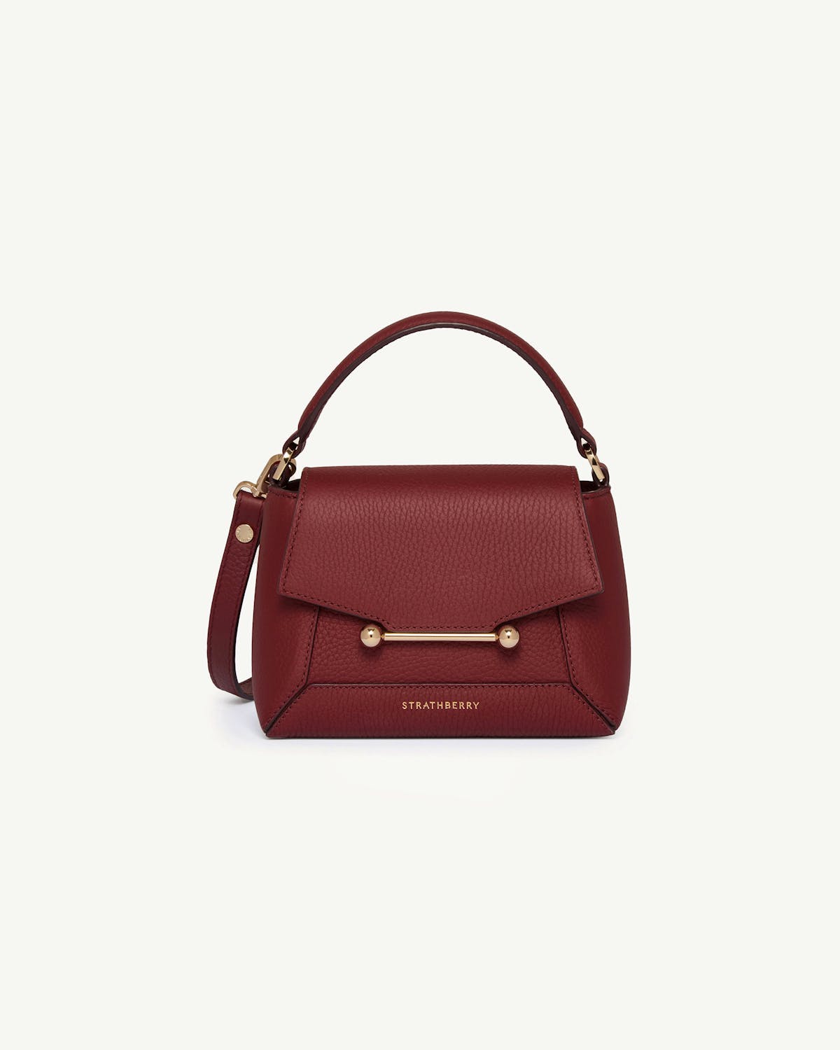 Strathberry Mosaic Nano handbag in oxblood with top handle and bar closure.