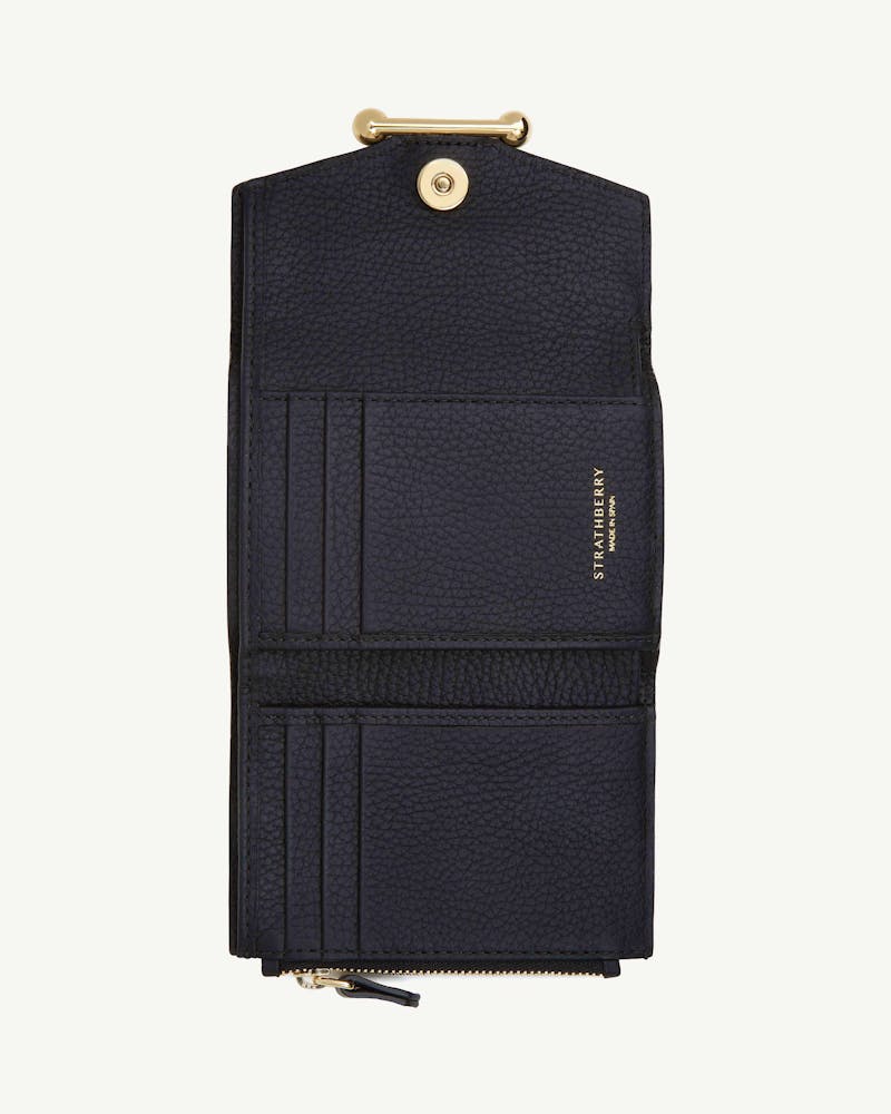 Black Strathberry trifold wallet open, showing card slots and zip pocket.