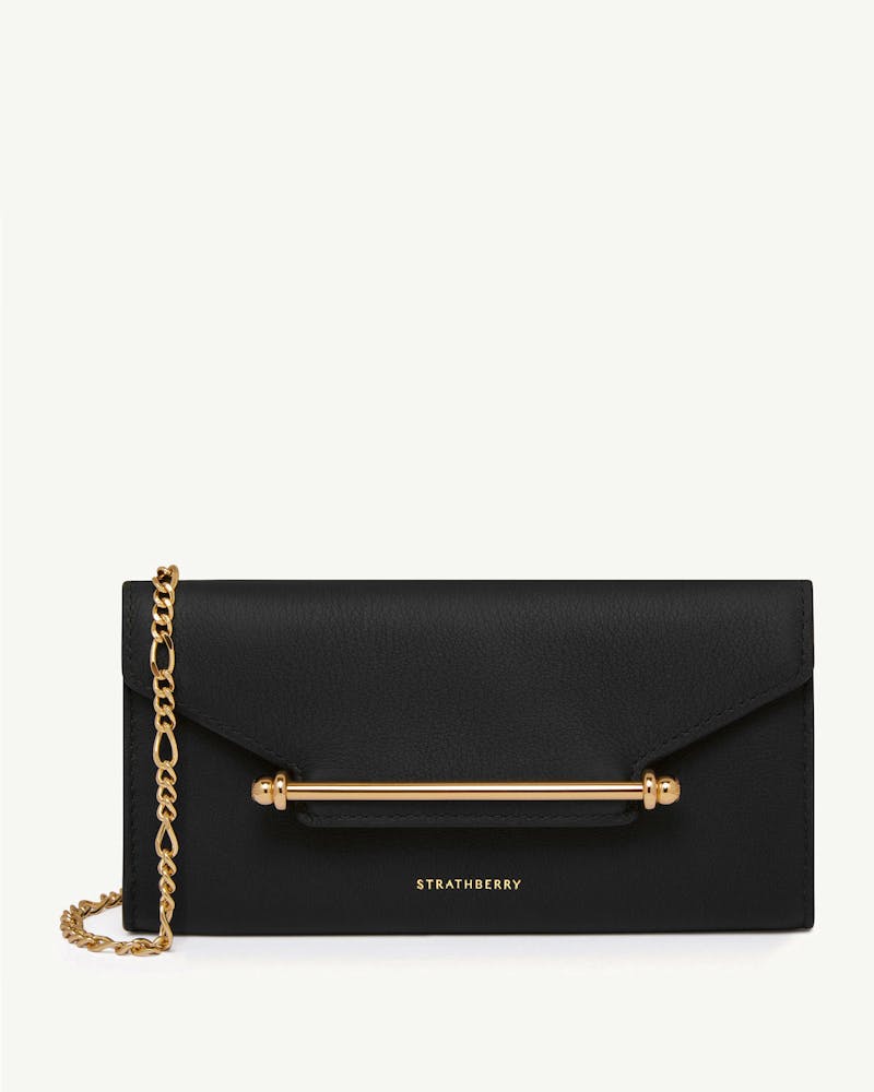 Black Strathberry Multrees chain wallet with gold bar and chain strap.