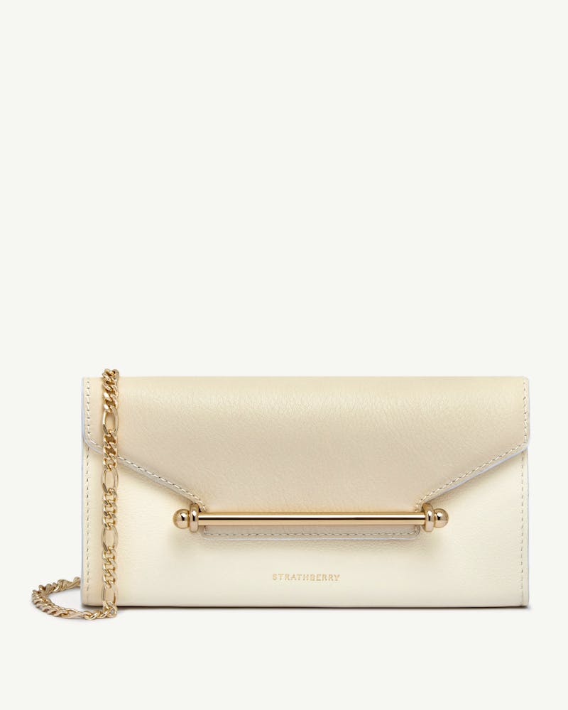 Strathberry Multrees chain wallet in vanilla and diamond leather with gold bar and chain strap.