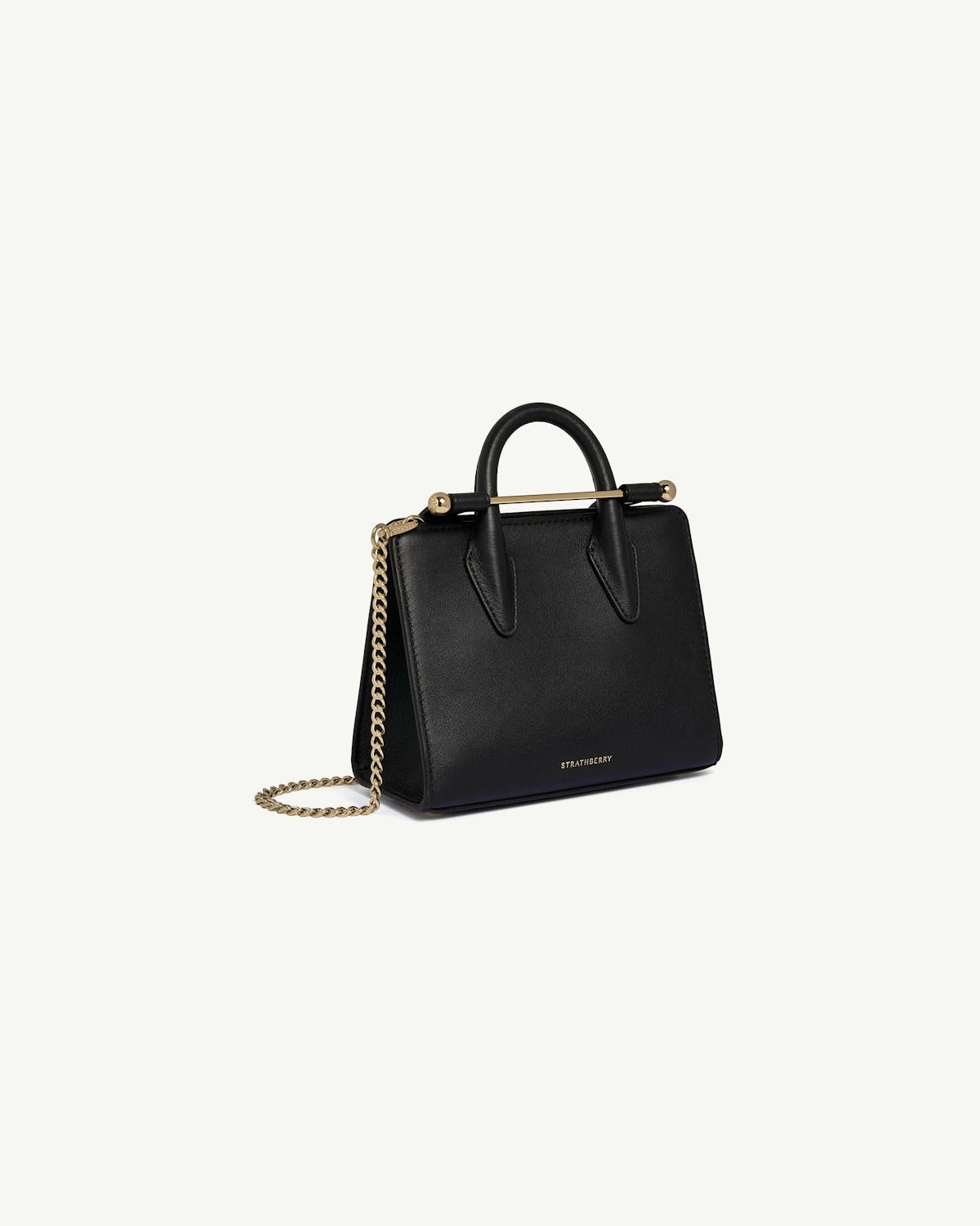 Strathberry black nano tote with gold bar closure and chain strap