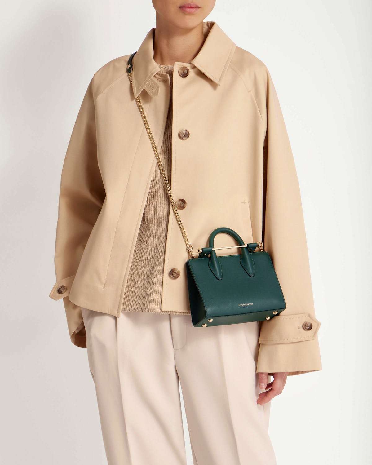 Strathberry bottle green nano tote with gold chain strap worn crossbody