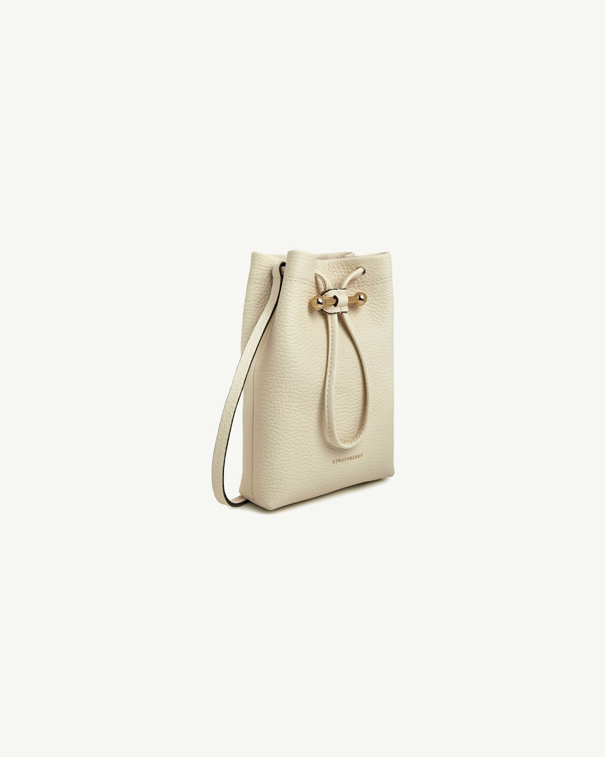 Vanilla leather Osette midi pouch with drawstring, shoulder strap and Strathberry logo.
