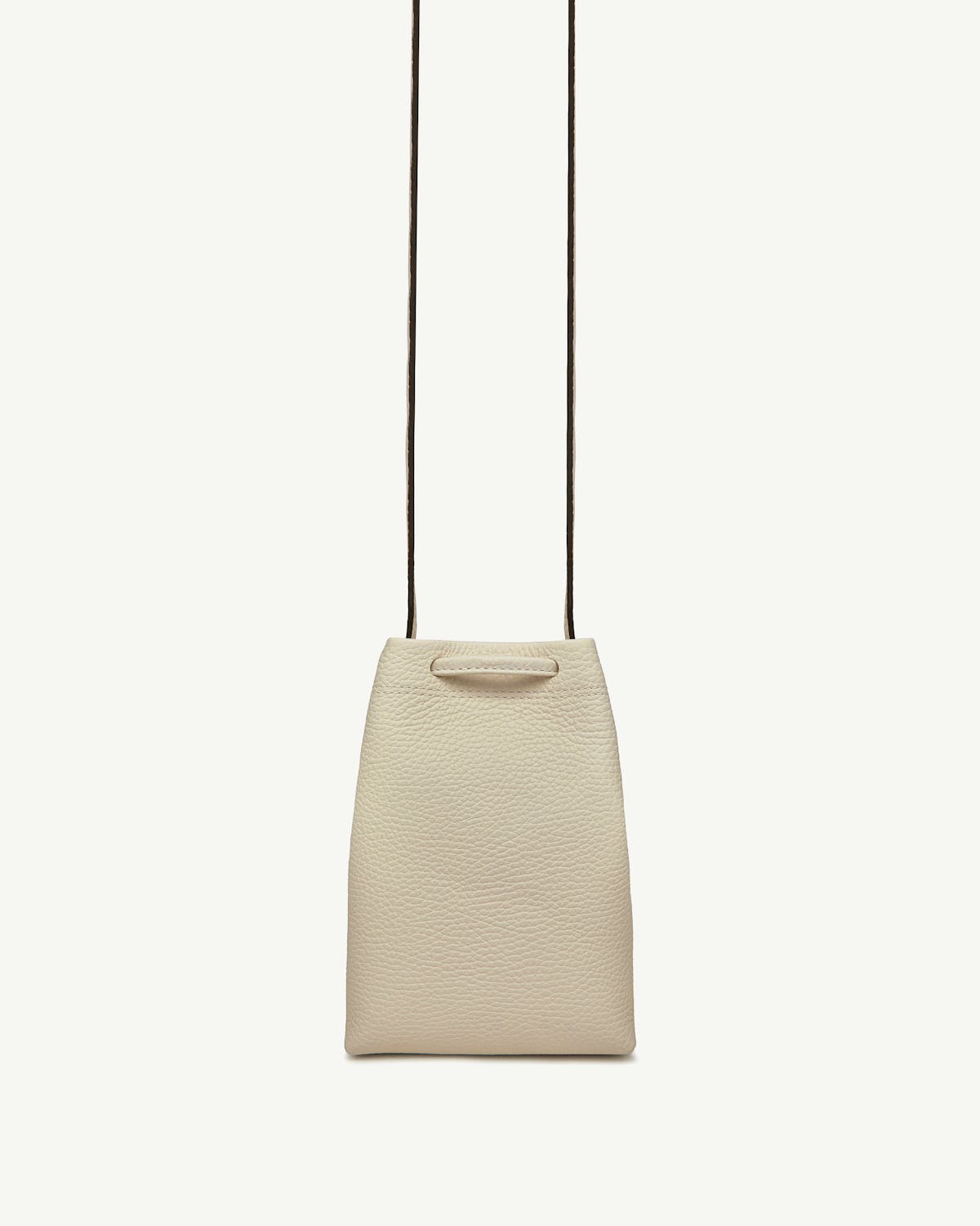 Vanilla leather midi pouch with thin dark shoulder strap on white background.