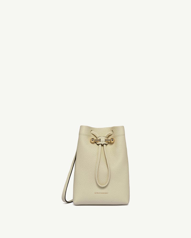 Strathberry Osette midi pouch in vanilla leather with drawstring and cross-body strap