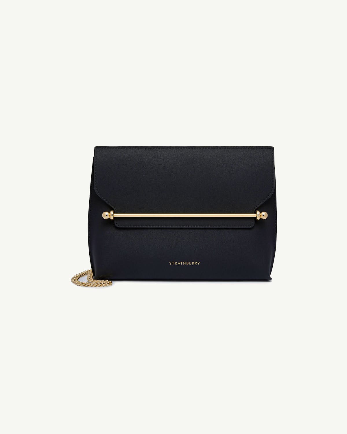 Black Strathberry stylist bag with gold bar and chain on white background