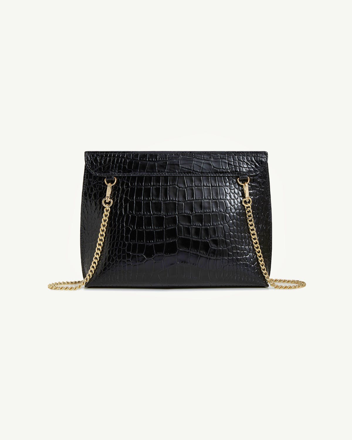 Black croc-embossed stylist bag with gold chain on white background.