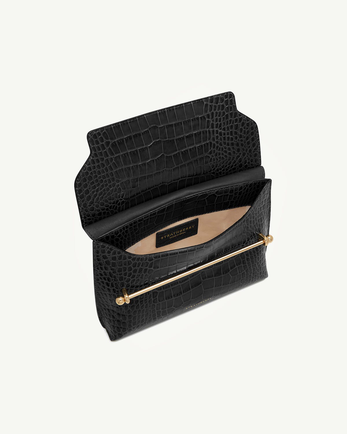 Strathberry black croc-embossed Stylist bag open showing beige interior and gold bar closure