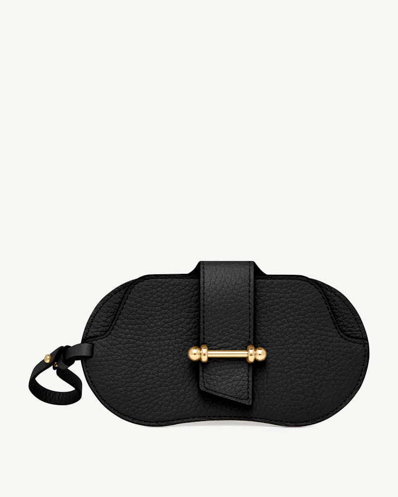 Black pebbled leather sunglasses case with gold bar closure and leather wrist strap